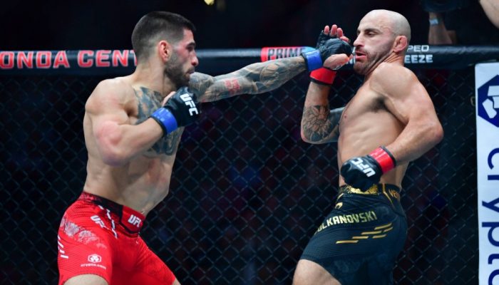 Feb 17, 2024; Anaheim, California, USA; Ilia Topuria moves in with a hit against Alexander Volkanovski during UFC 298 at Honda Center. Mandatory Credit: Gary A. Vasquez-USA TODAY Sports