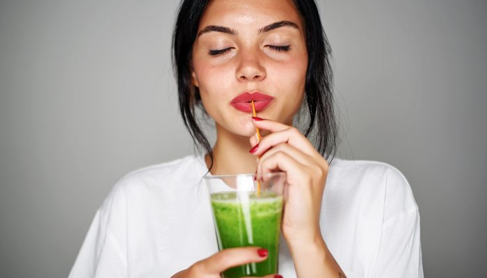 Young woman drink smoothie healthy detox