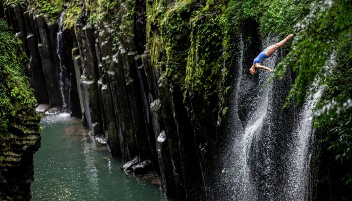 Rhiannan Iffland of Australia dives from the 16.5 metre waterfall during the first competition day of the fourth stop of the Red Bull Cliff Diving World Series in Takachiho, Japan on August 2, 2023. // Dean Treml / Red Bull Content Pool // SI202308020120 // Usage for editorial use only //