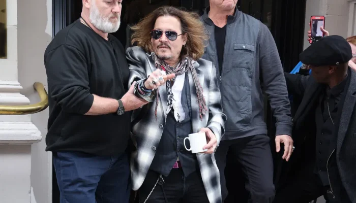 johnny-depp-helped-out-of-hotel0-