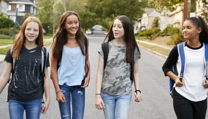 web3-teenager-teenage-teen-girl-children-friends-walk-street-school-bags-shutterstock_787002394